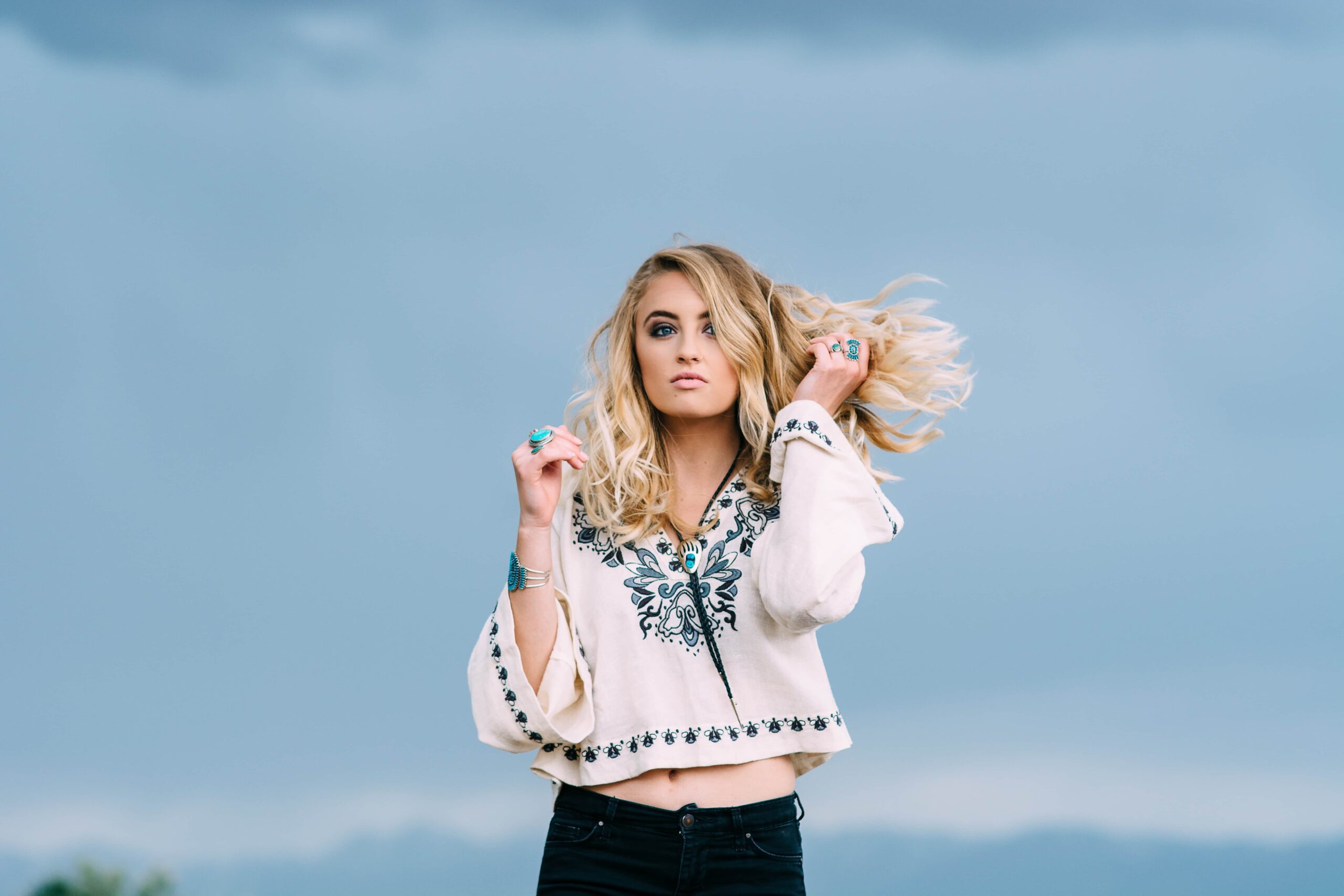 woman-sky-hair-tops